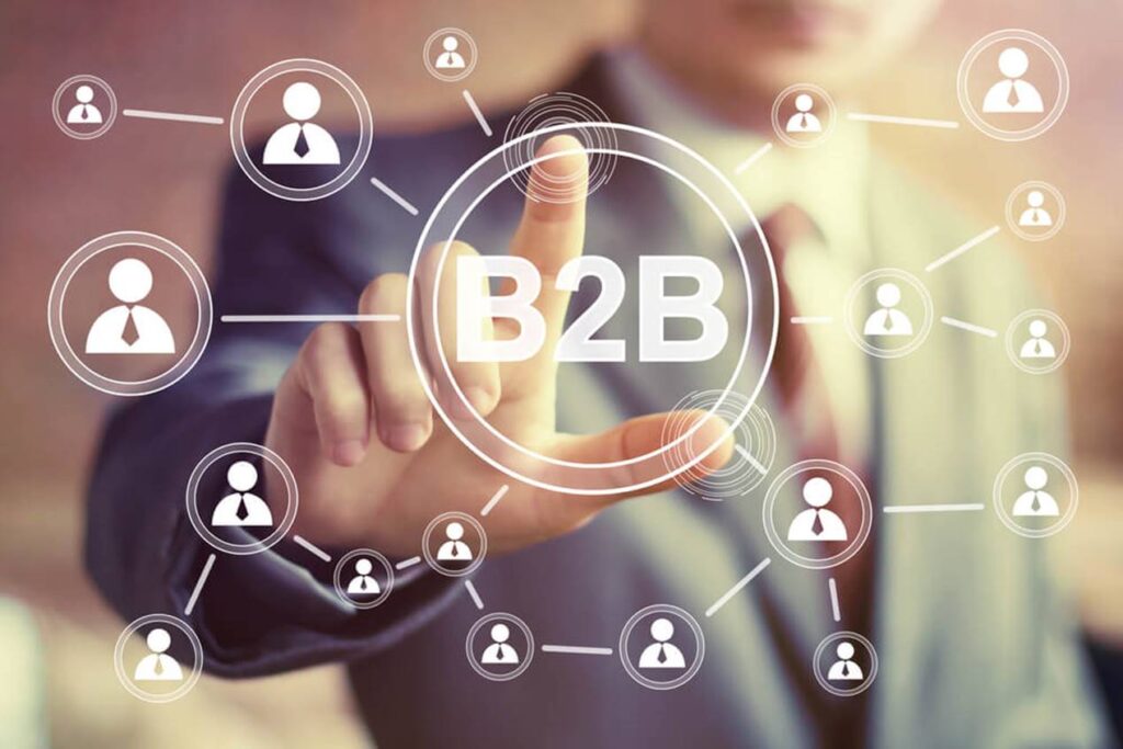 A person pointing at a digital network representing B2B connections.
